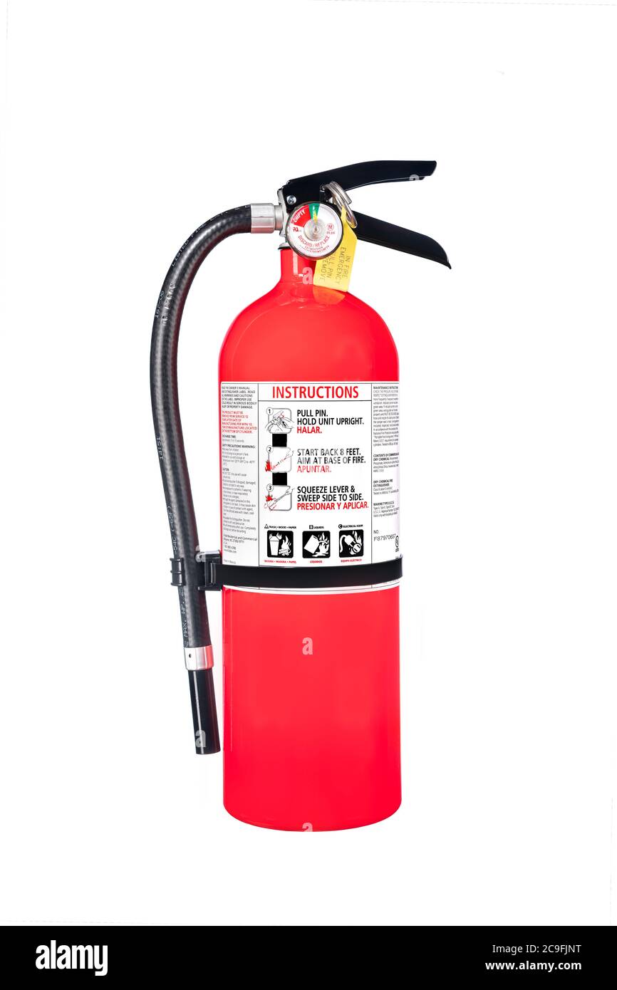 Ein klassischer roter Feuerlöscher isoliert auf Weiß für den Einsatz als Designelement oder Sicherheitsinferenz für den Heim- und Geschäftsschutz. Stockfoto