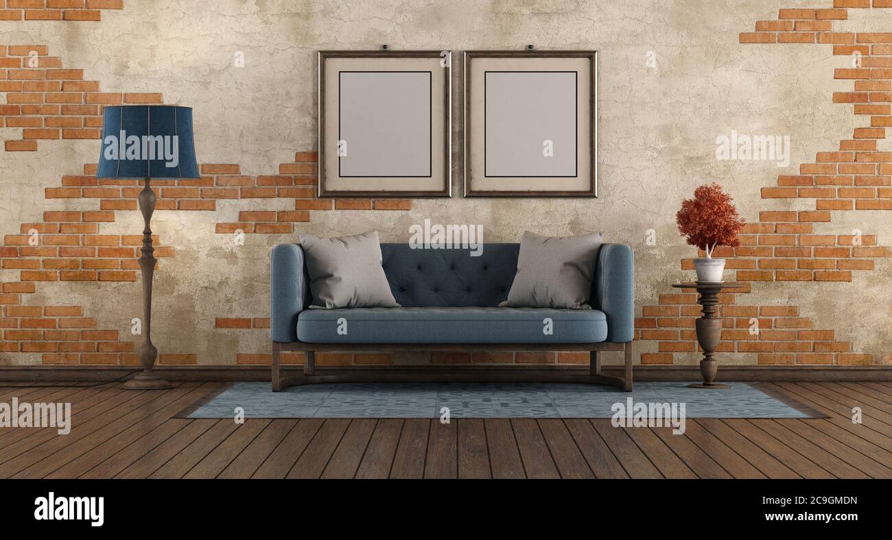 Wohnzimmer mit blauem klassischen Sofa, Stehlampe und Bild frane agaist alte Backsteinwand - 3d-Rendering Stockfoto