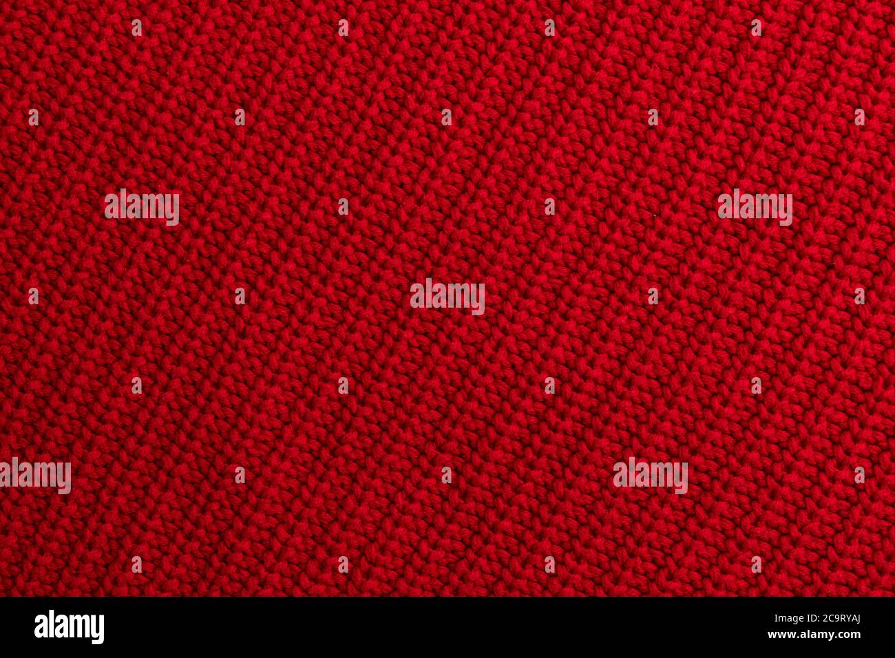 Rot gestrickt Wollstoff Hintergrund Stockfoto