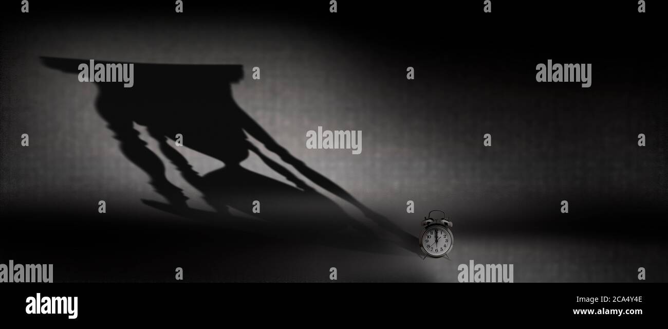 Uhr mit Sanduhr Schatten Stockfoto