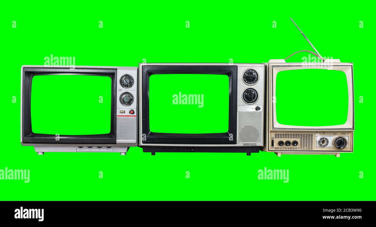 Drei Vintage-Fernseher mit grünen Farbbildschirmen und Hintergrund. Stockfoto