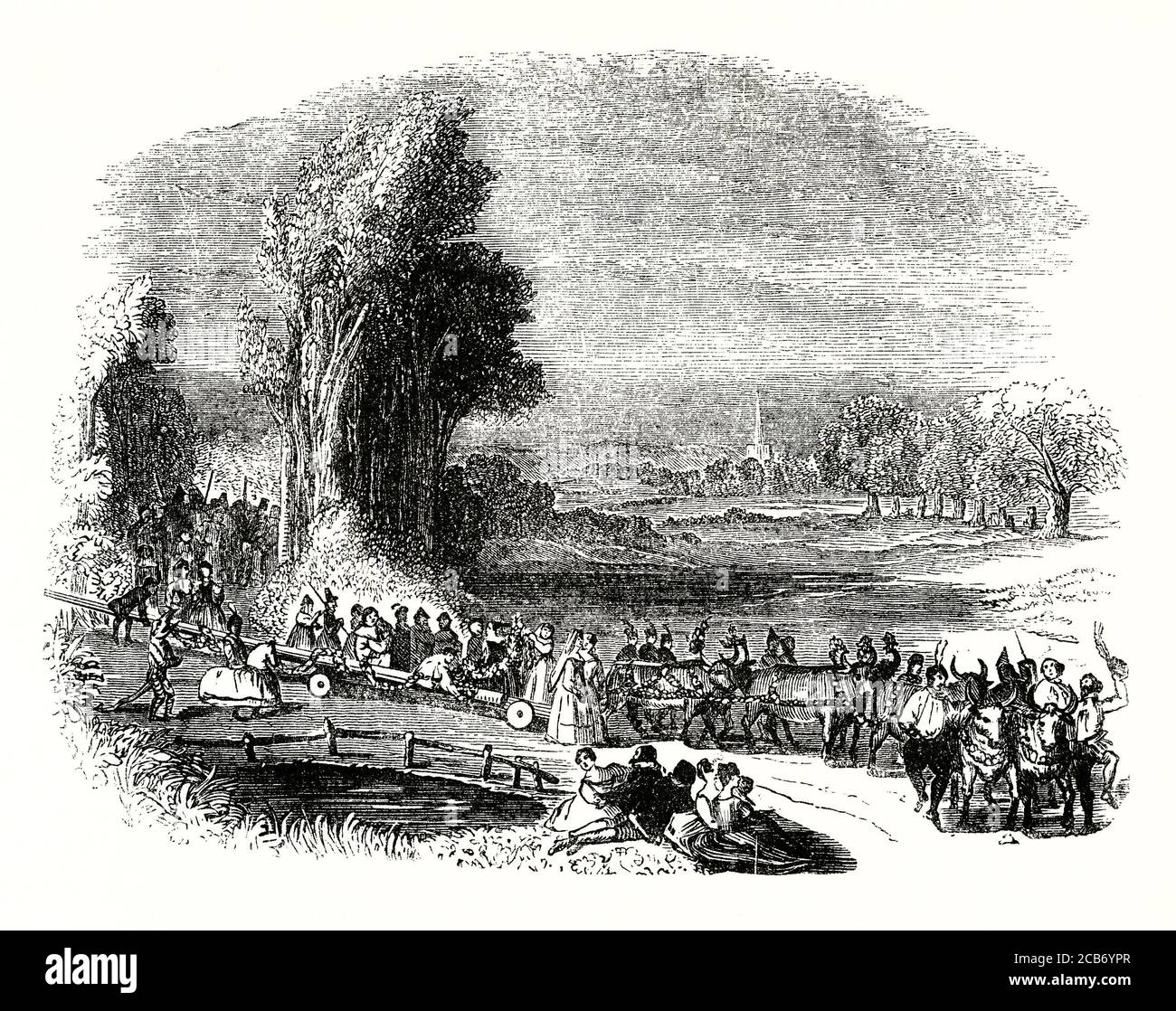 Eine alte Gravur mit einer Prozession, die einen Maibaum einbringt, der am 1. Mai (oder am ersten Montag im Mai) aufgestellt werden kann. Die Stange ist auf Rädern von Bulllocks gezogen. Der Maibaum ist ein hoher Holzpfahl, der als Teil verschiedener europäischer Volksfeste errichtet wurde, um den herum oft ein Maibaum tanzt. Der Maifeiertag ist ein alter Feiertag, der normalerweise am 1. Mai oder am ersten Montag im Mai gefeiert wird. Tänze, Gesang und Kuchen sind in der Regel Teil der Feierlichkeiten. Stockfoto