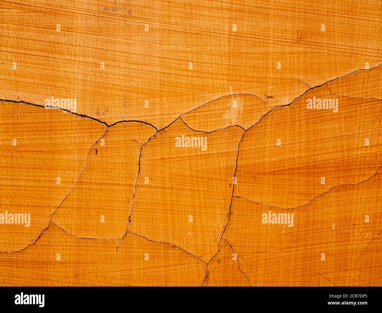 Gebrochene Risse orange Wandstruktur Stockfoto