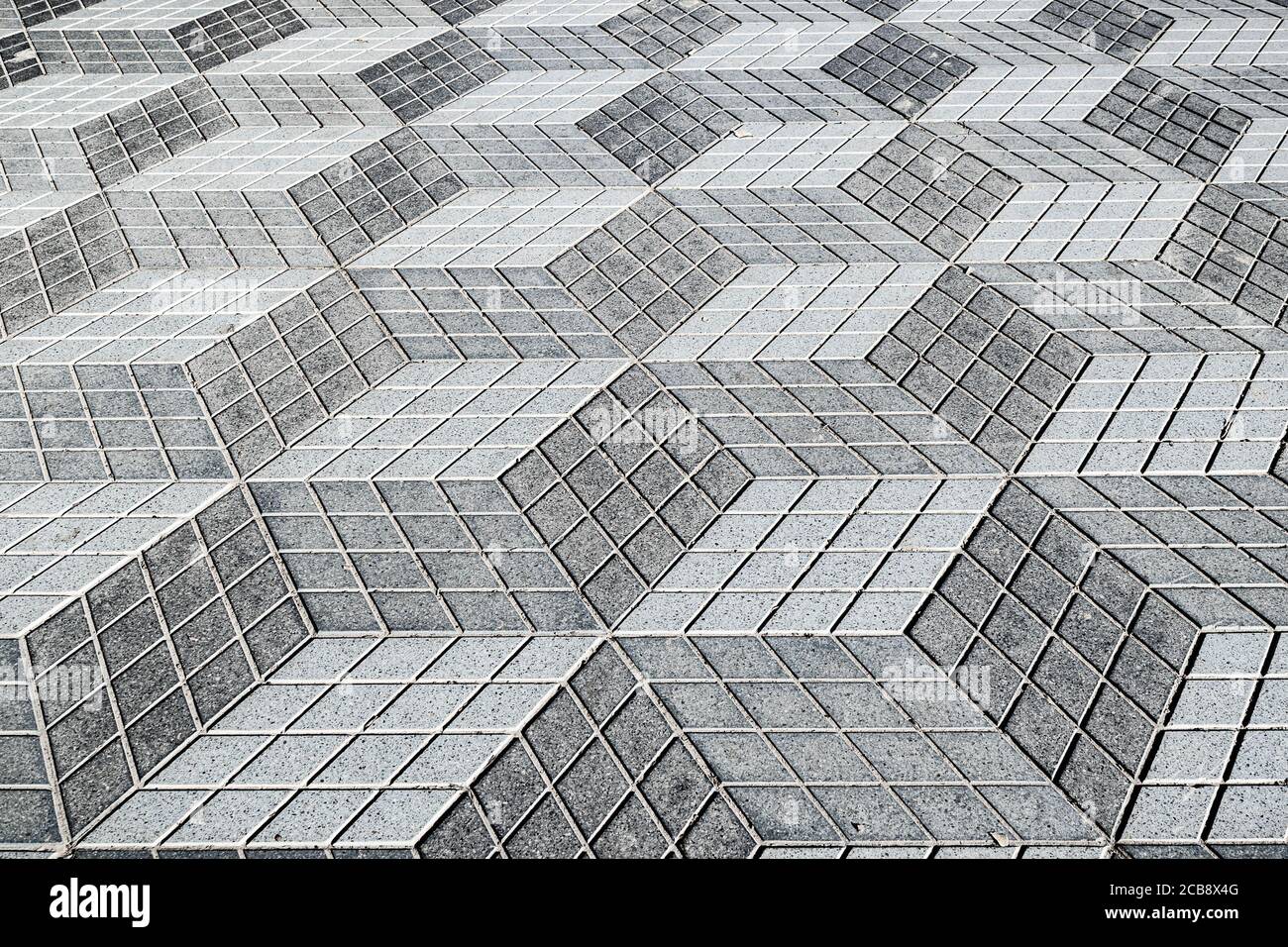 Nahaufnahme des geometrischen Kachelmusters der Promenade La Rambla in der Innenstadt von Alicante. Geometrischer Hintergrund mit abstrakter Textur. Stockfoto