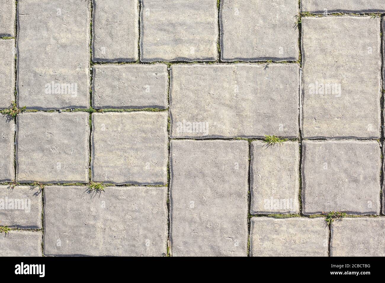 Struktur aus Steinfliesen, abstrakte Struktur auf dem Straßenboden Stockfoto