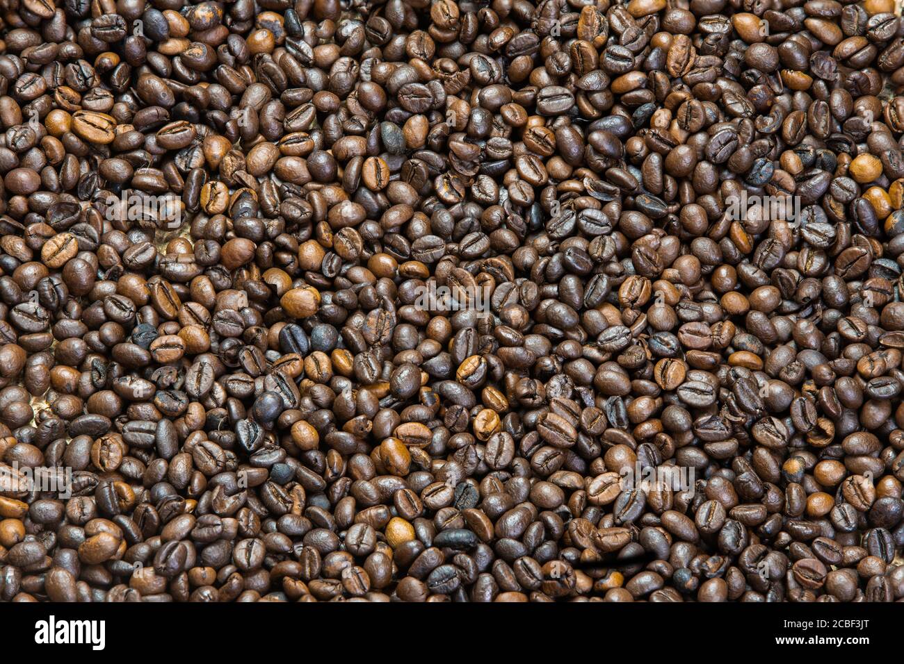 Makro-Foto von gerösteten Kaffeebohnen Hintergrund Stockfoto