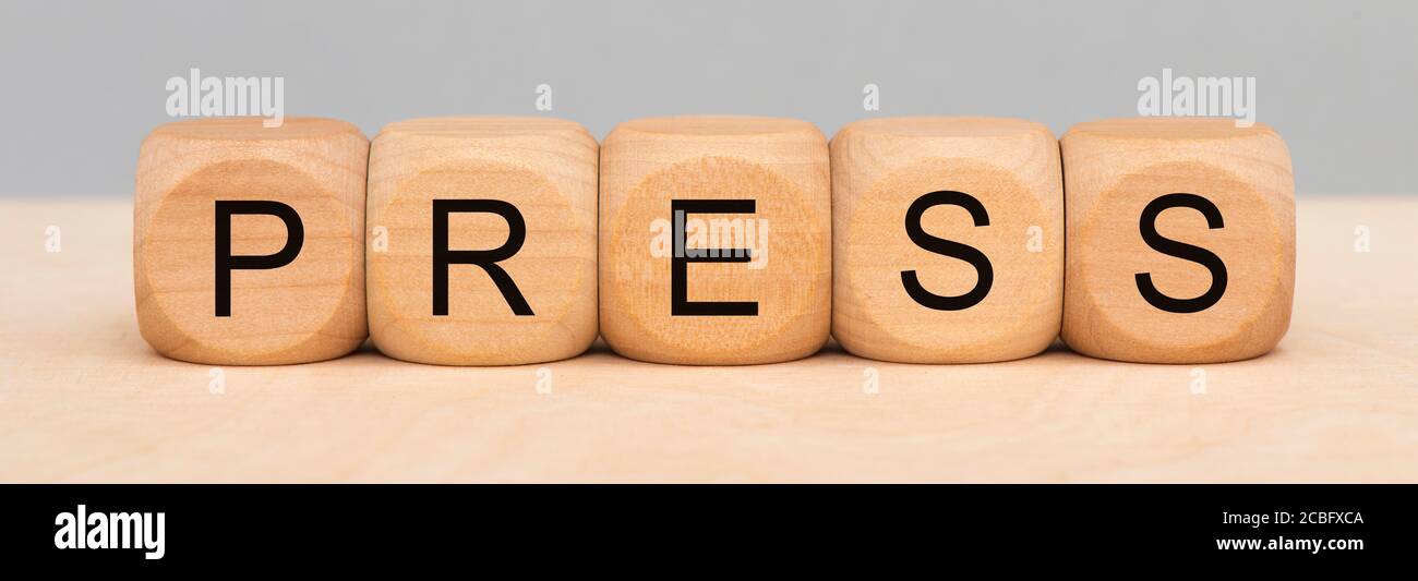Drücken Sie auf Holzwürfel gedruckt Stockfoto
