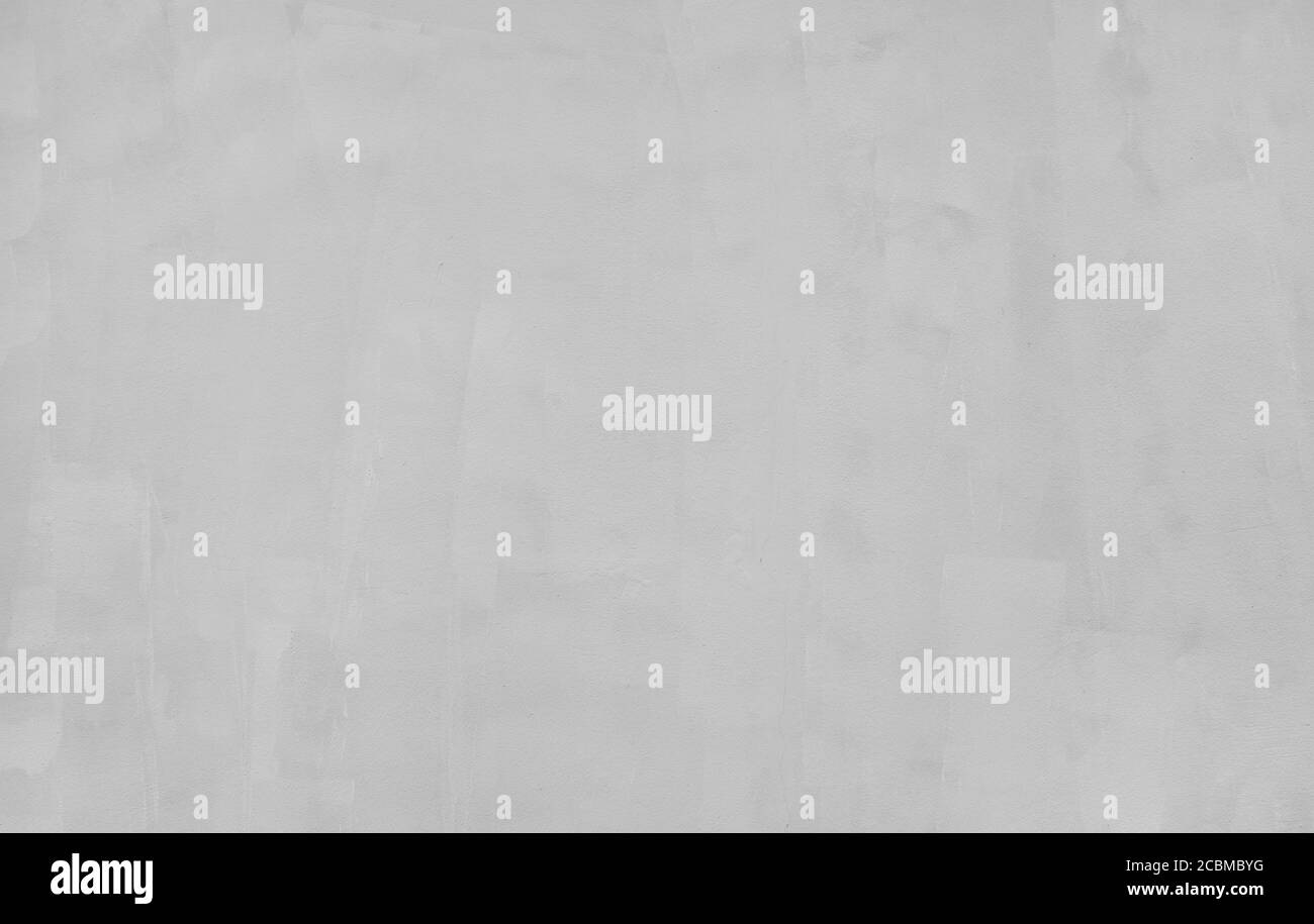 Detailliertes Fragment der grauen Zementwand mit Gips. Qualitativer abstrakter Hintergrund. Stockfoto