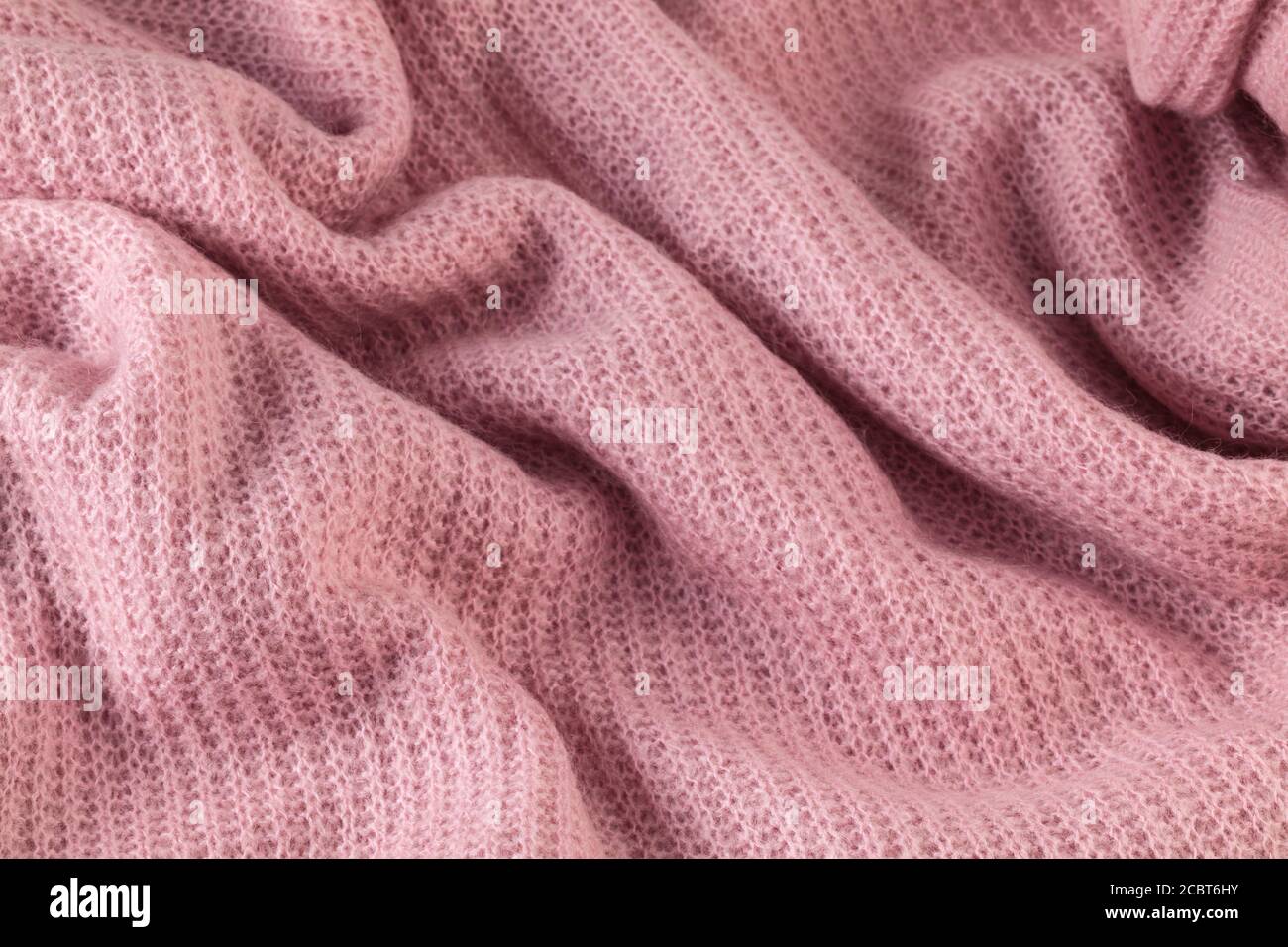 Detail von rosa warmen Stoff Textur Material Hintergrund. Stockfoto