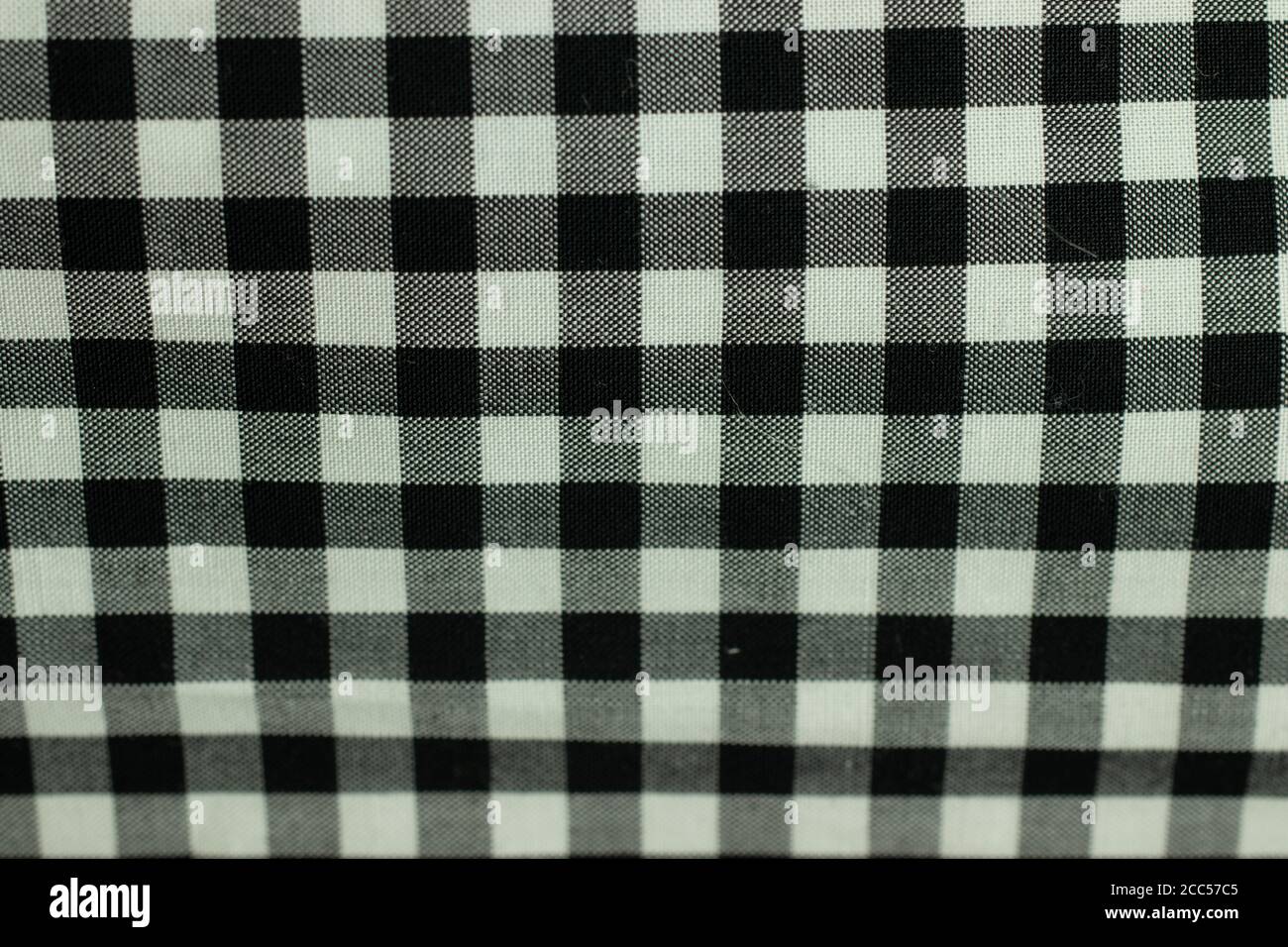 Weiße und schwarze Zellen Gewebe. Hintergrunddesign mit Textur Stockfoto