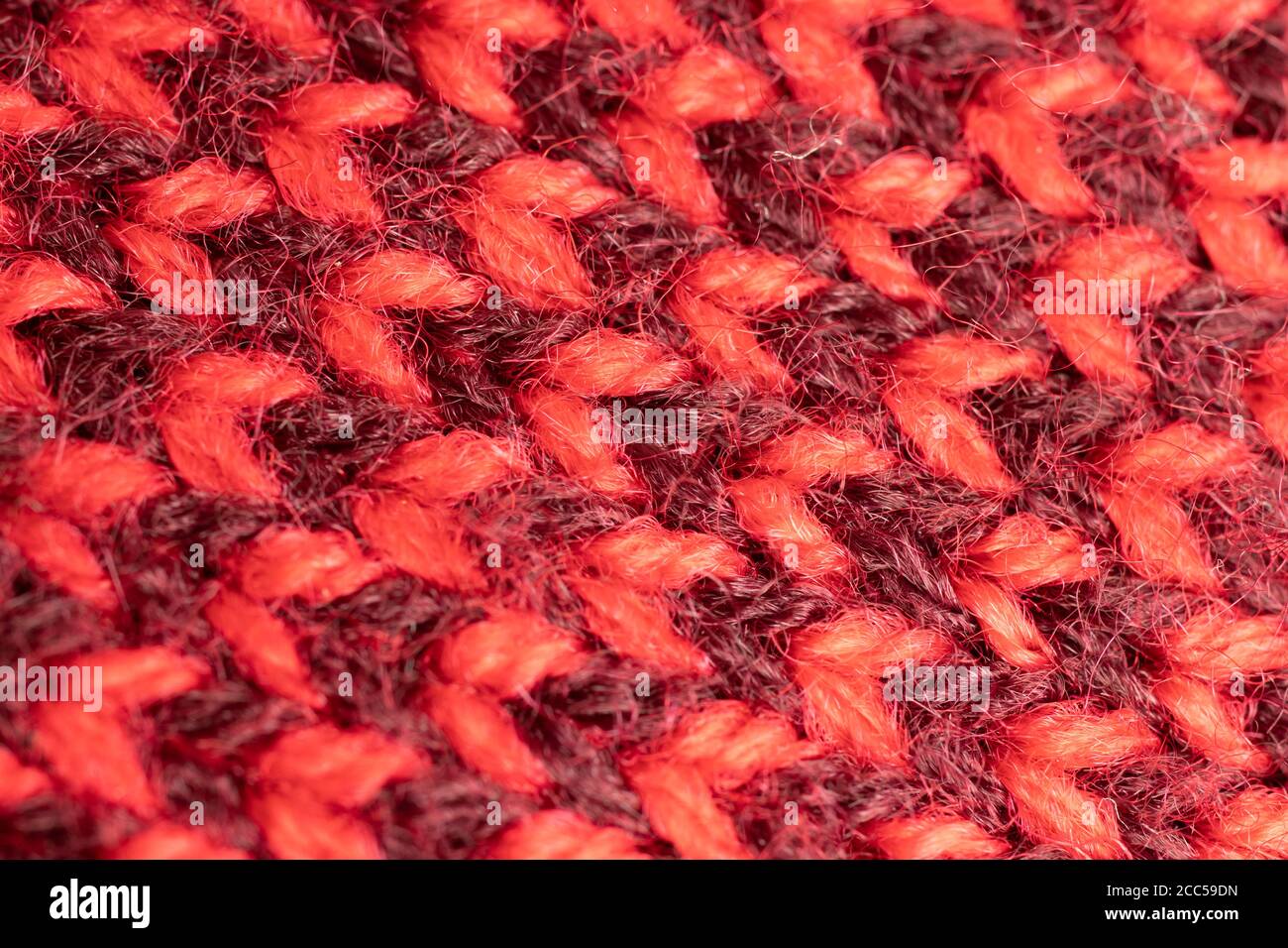 Rote Textur textiler Hintergrund mit Muster Stockfoto