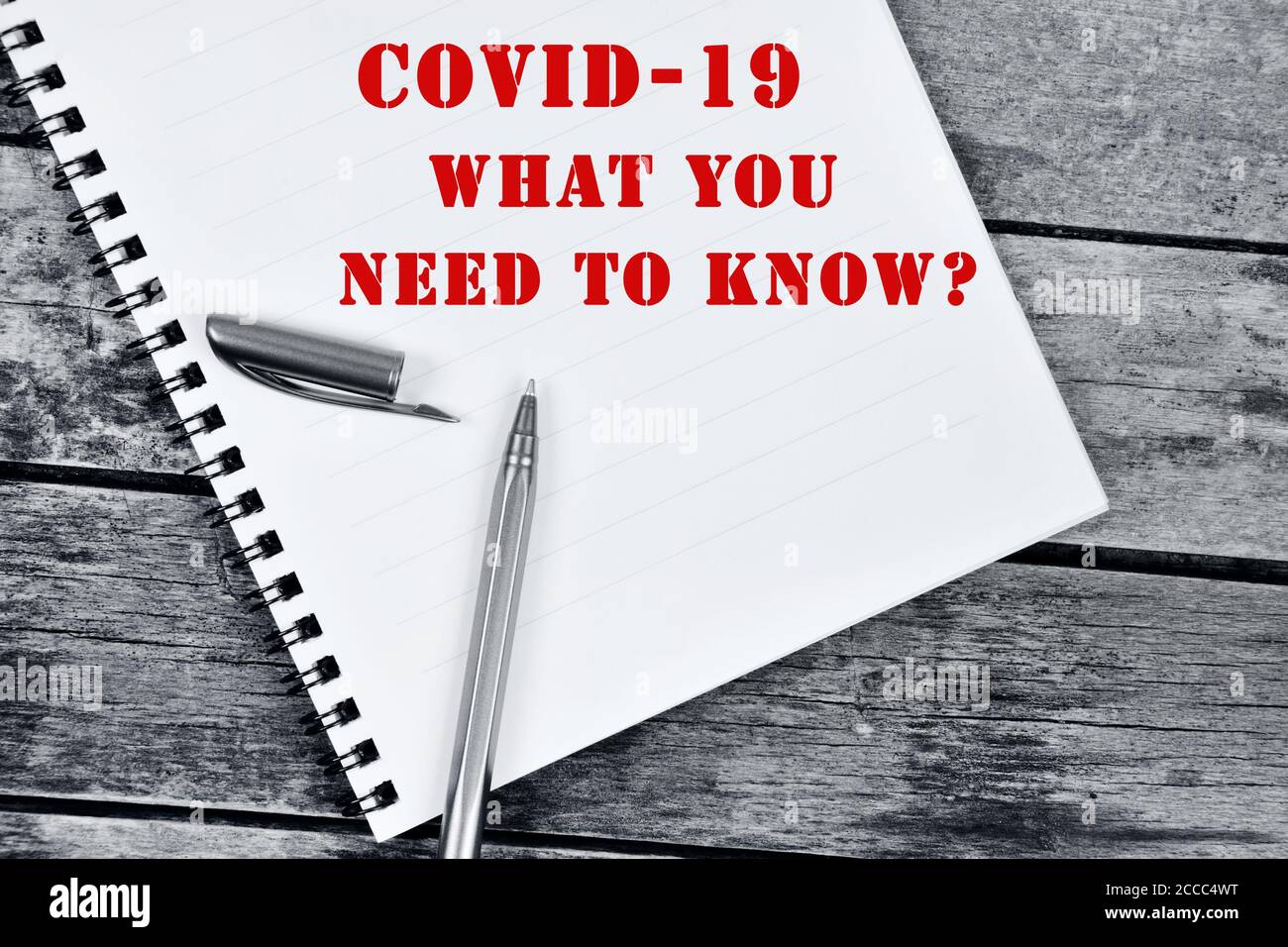Covid-19 Was Sie wissen müssen Frage auf Notebook-Seite Stockfoto