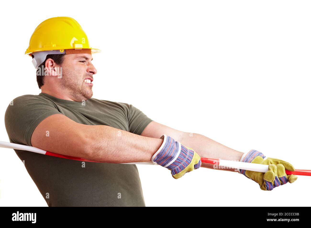 Bauarbeiter zieht an einem Sperrband Stockfoto