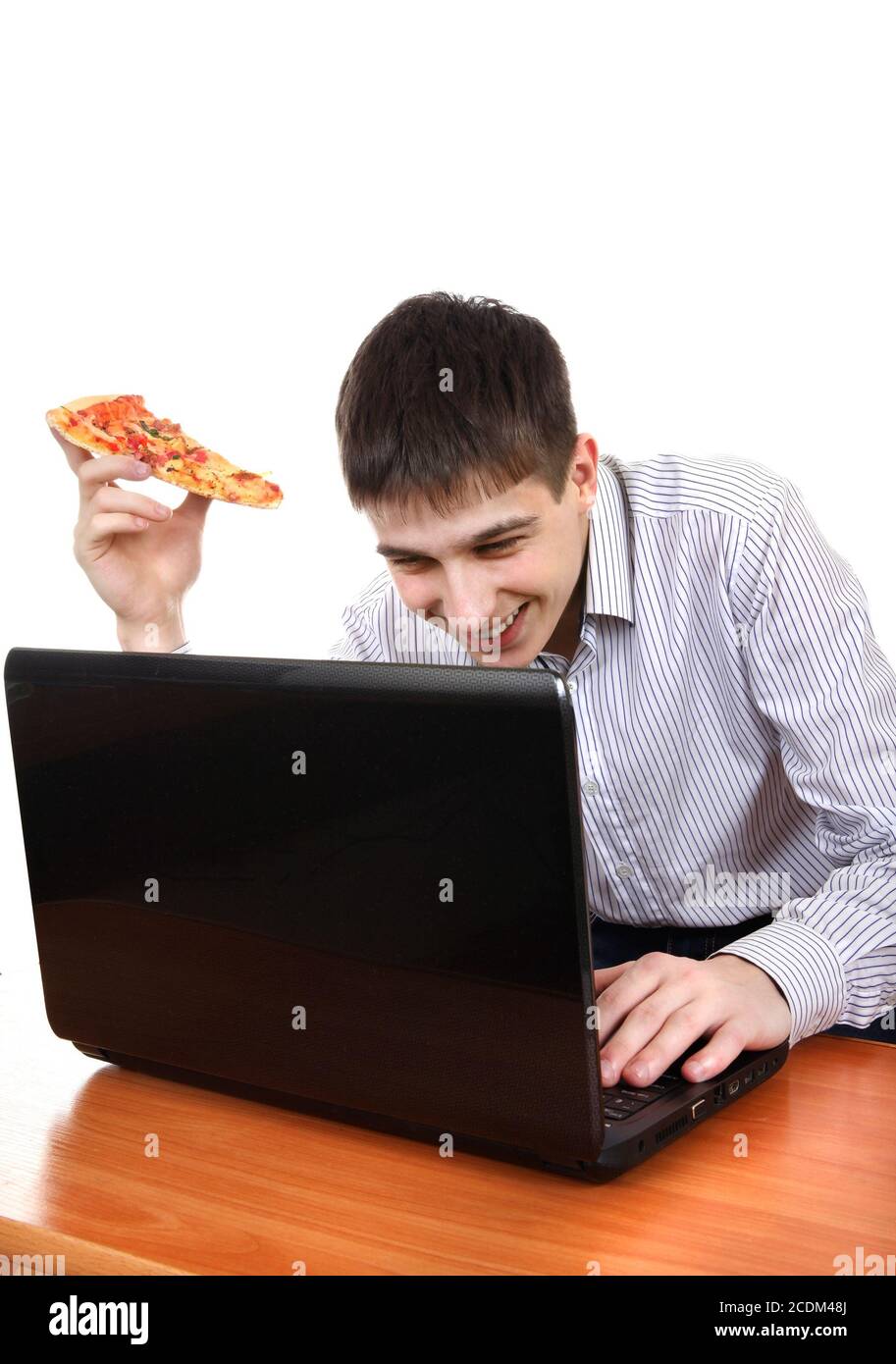Teenager mit Laptop und Pizza Stockfoto
