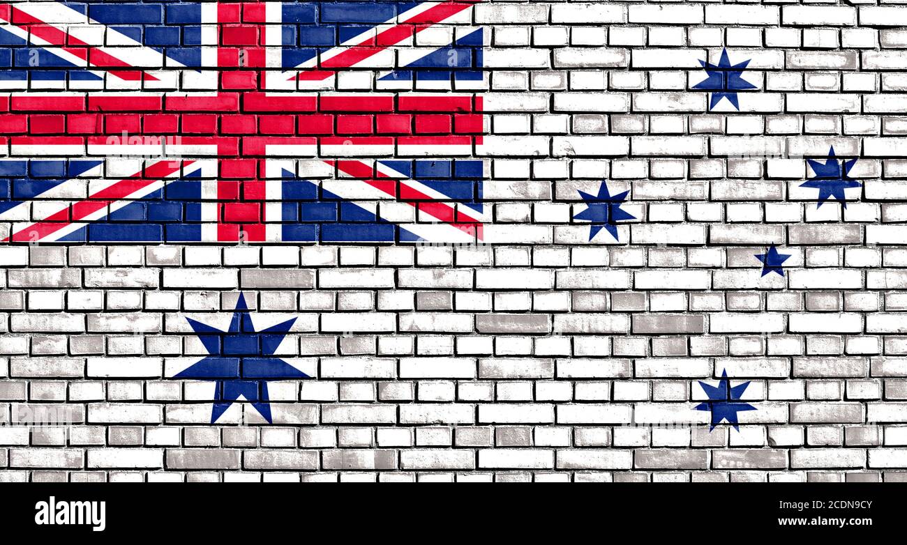 Die australische weiße Ensign Flagge auf Ziegel gemalt Stockfoto