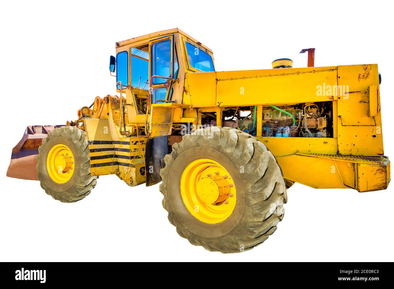 Seitenansicht eines gelben Traktors isoliert auf weißem Hintergrund mit Kopierraum. Stockfoto