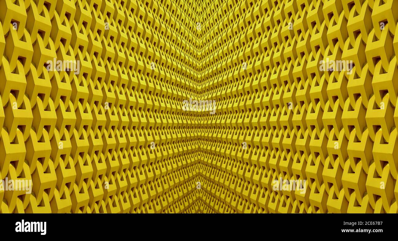 Abnehmende Perspektive einer symmetrischen architektonischen Linien in gelber Farbe Stockfoto