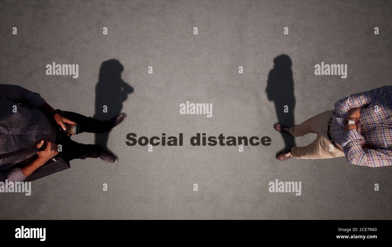 Konzept oder konzeptionelle 3d-Illustration eines Menschen zu Mann treffen nach sozialen Abstand Richtlinien auf einem Holzboden Hintergrund. Stockfoto