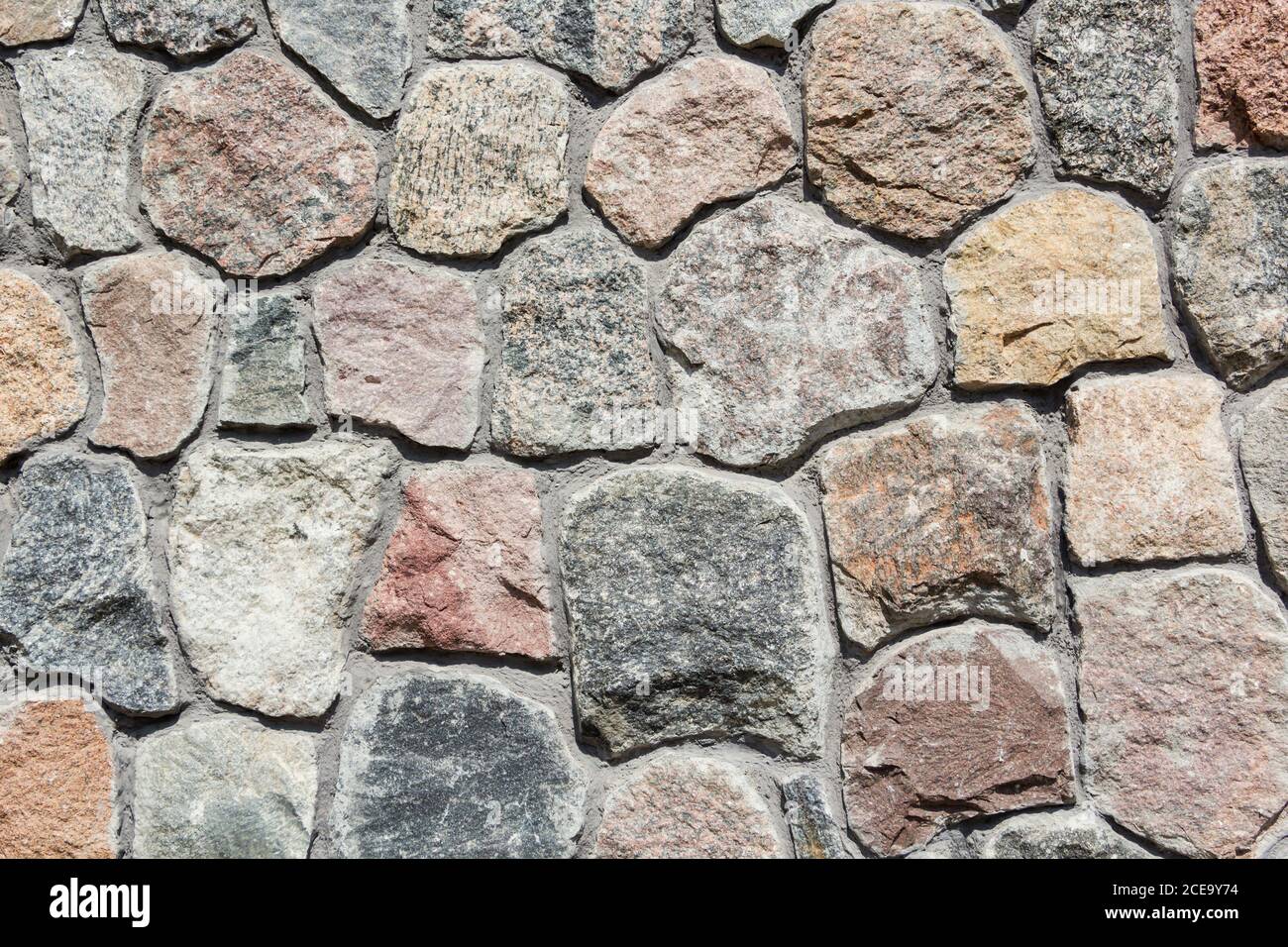 Ordentlich gestapelt grob geschnitten Stein Wand Textur Hintergrund. Stockfoto