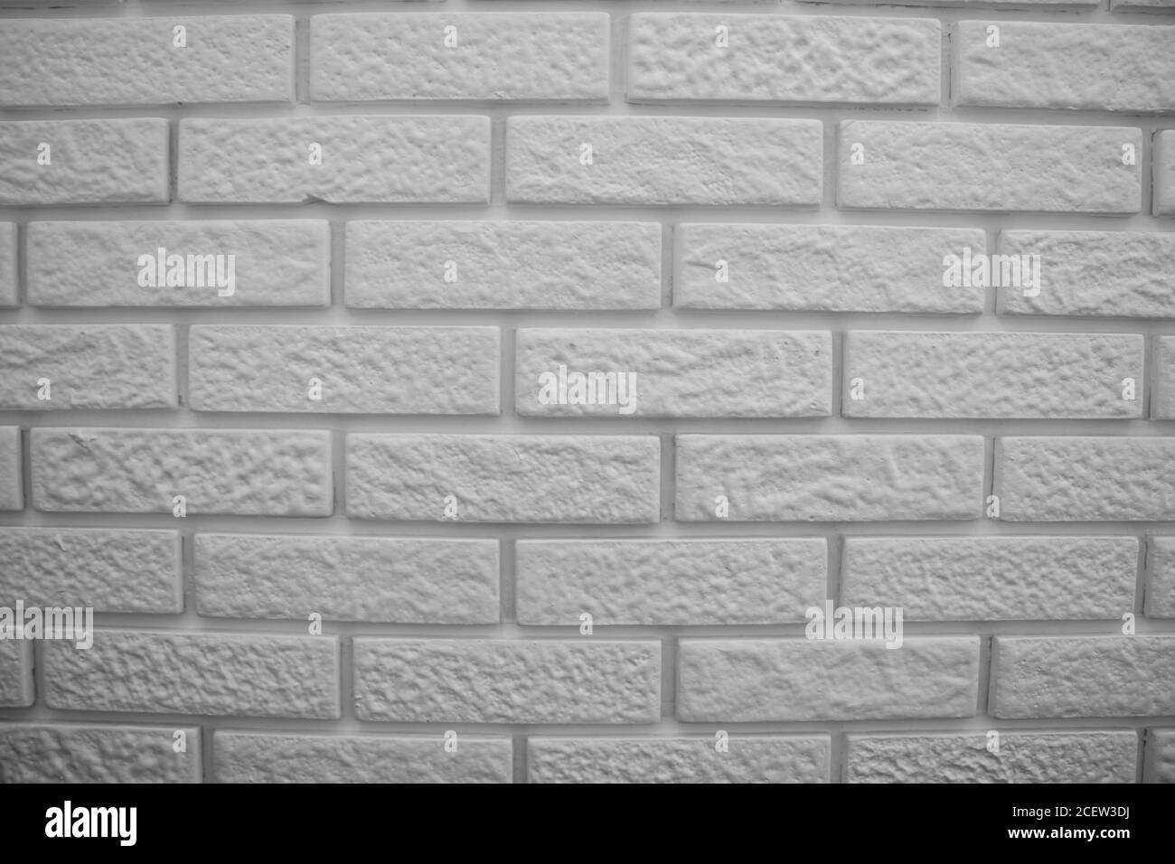 Moderne Backsteinmauer, grau und weiß Foto Stockfoto