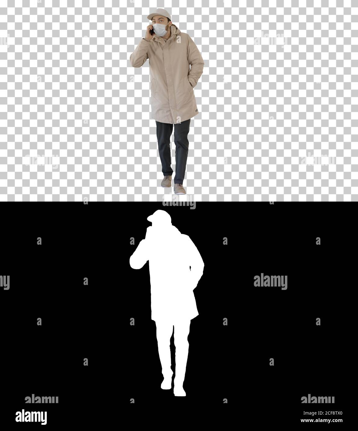 Casual Mann in Outdoor-Kleidung und medizinische Maske zu Fuß und Talki Stockfoto