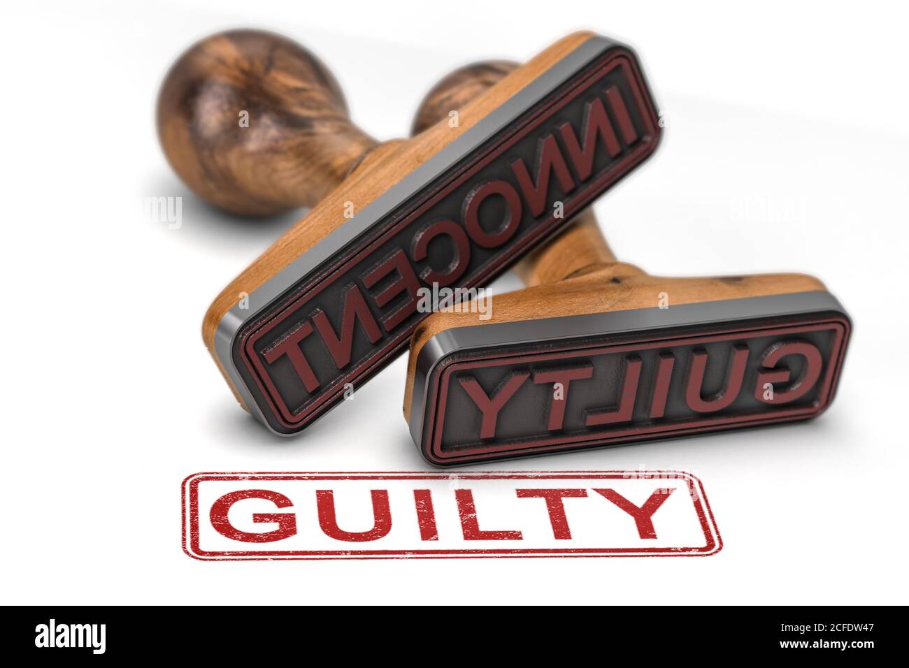 Zwei Gummistempel auf weißem Hintergrund mit den Worten unschuldig und schuldig, konzentrieren sich auf den zweiten. 3D-Illustration Stockfoto
