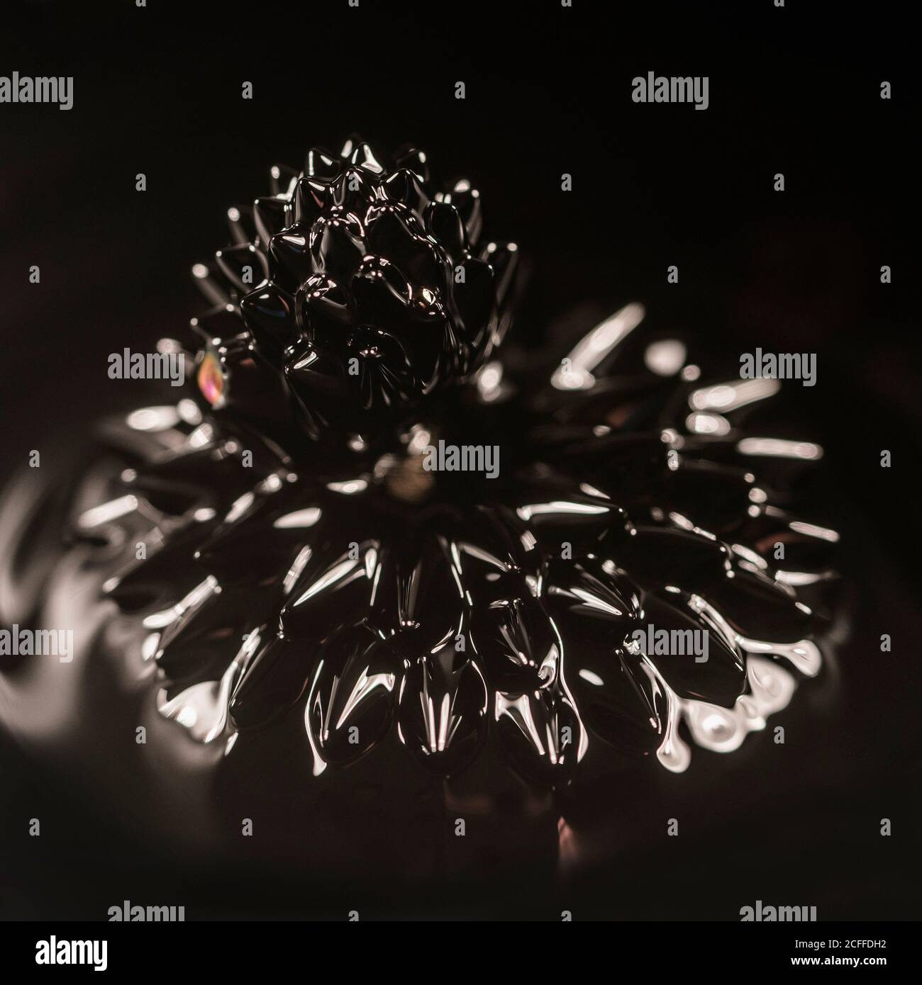 Abstrakter Hintergrund mit Nahaufnahme von braunem Ferrofluid Mit erstaunlichen Formen während der magnetisierten Wirkung in Gegenwart eines Magnetfeld Stockfoto