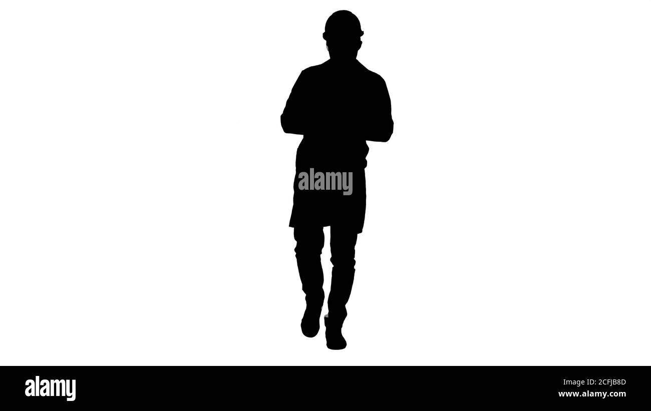 Silhouette moderne junge phisicist zu Fuß und Lesung Nachricht am Telefon. Stockfoto