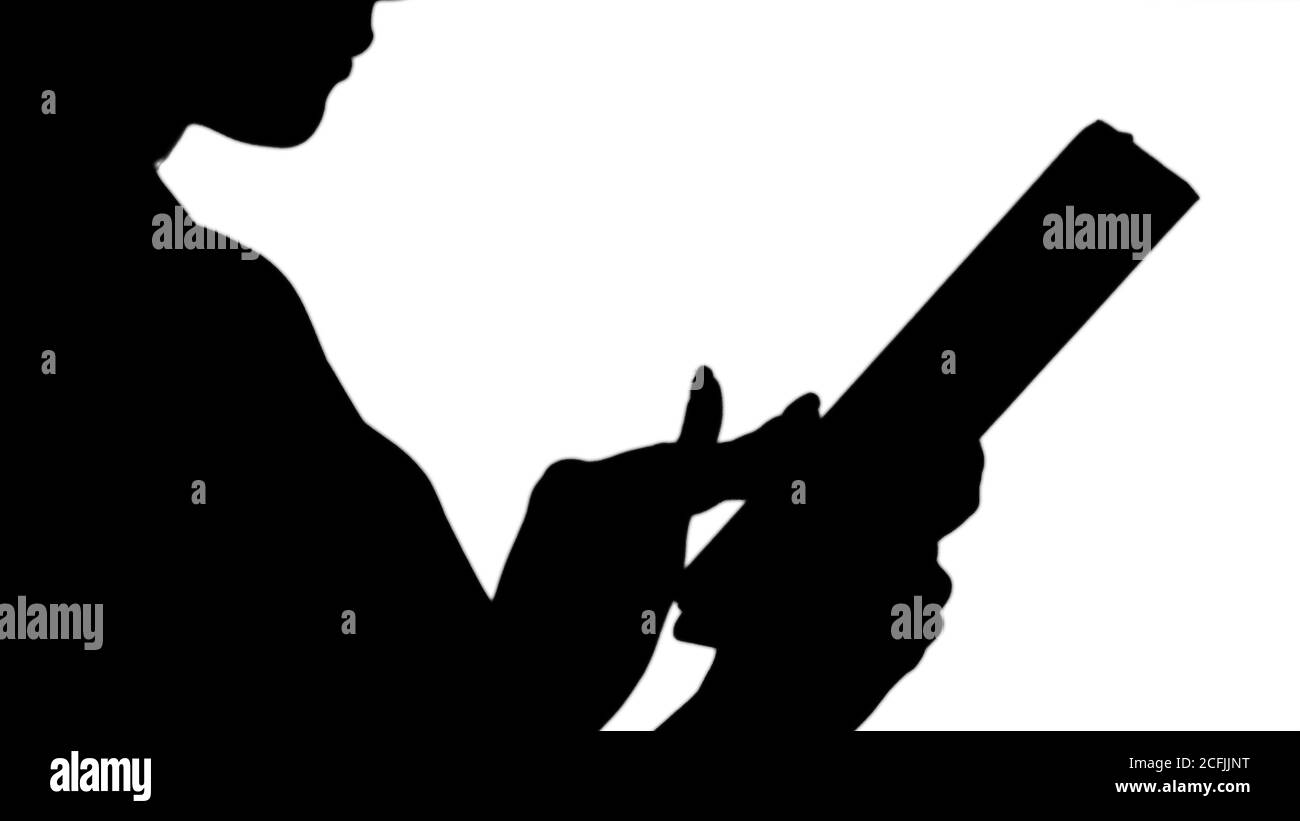 Silhouette weibliche Hände mit Tablet. Stockfoto
