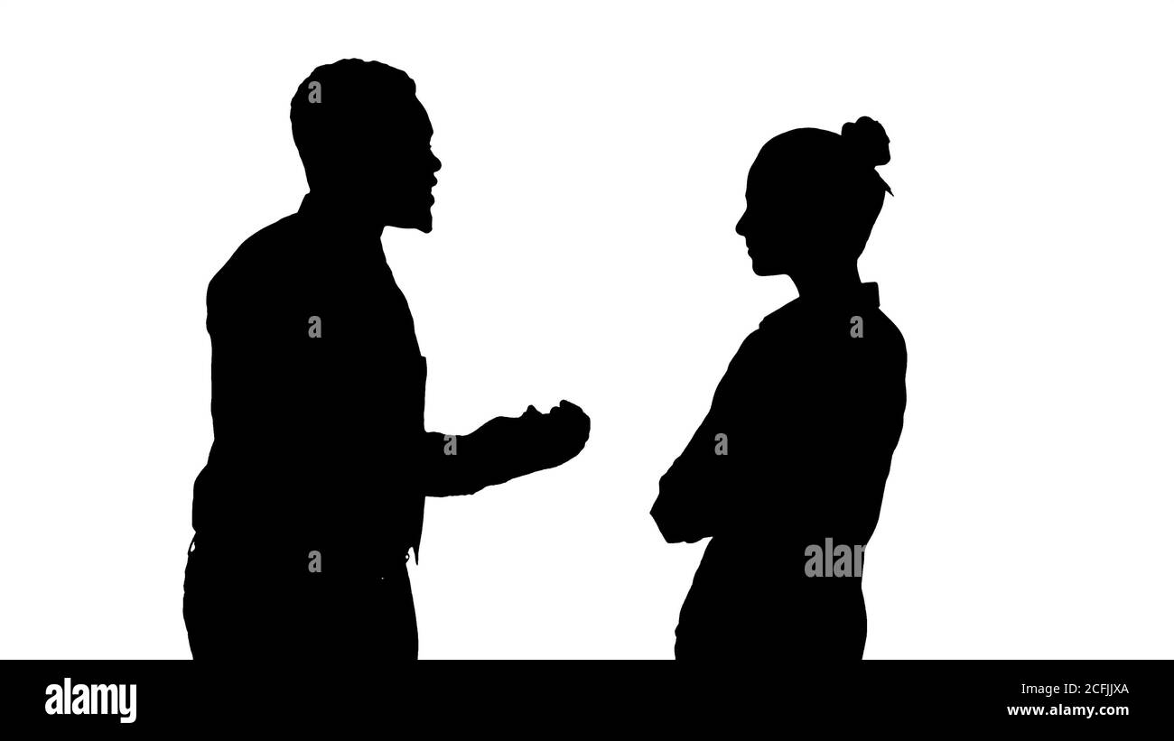 Silhouette Afrikanische amerikanische Geschäftsmann etwas zu erklären, sein Kollege. Stockfoto