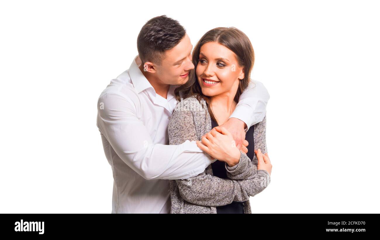 Nahaufnahme Millennial Paar in der Liebe. Porträt eines Paares, das eine glückliche Zukunft plant. Das Paar in der Liebe halten. Isoliert auf Weiß Stockfoto