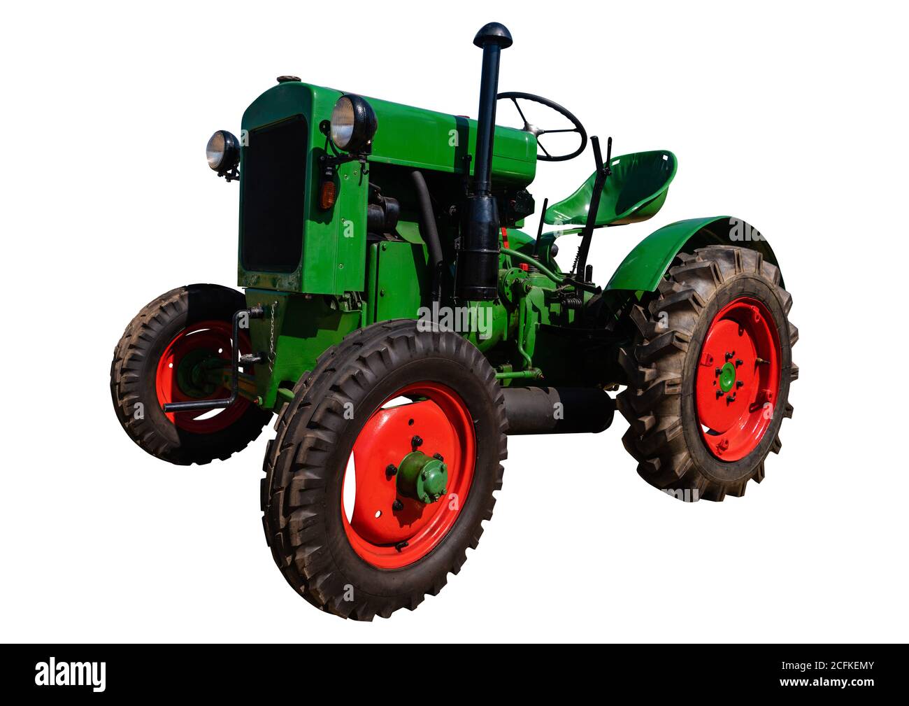 Alter Traktor isoliert auf weiß Stockfoto