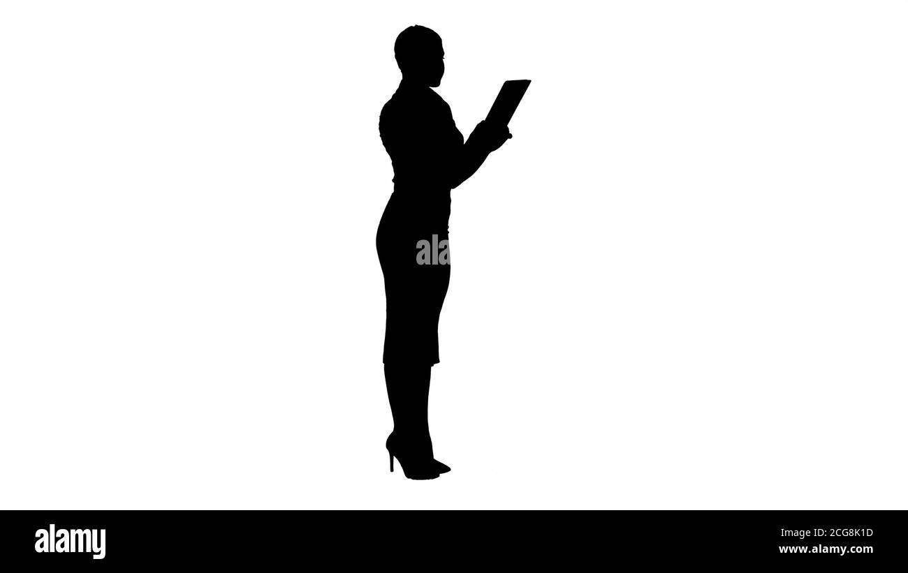 Silhouette schöne moderne Frau mit digitalen Tablet. Stockfoto