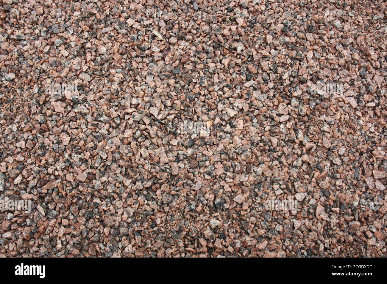 Textur von grobem Sand, Kieselsteine aus der Nähe. Hintergrund. Stockfoto