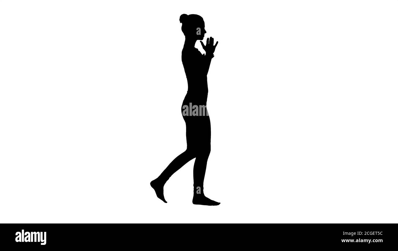 Silhouette Junge Frau üben Atemübungen und Gehen. Stockfoto