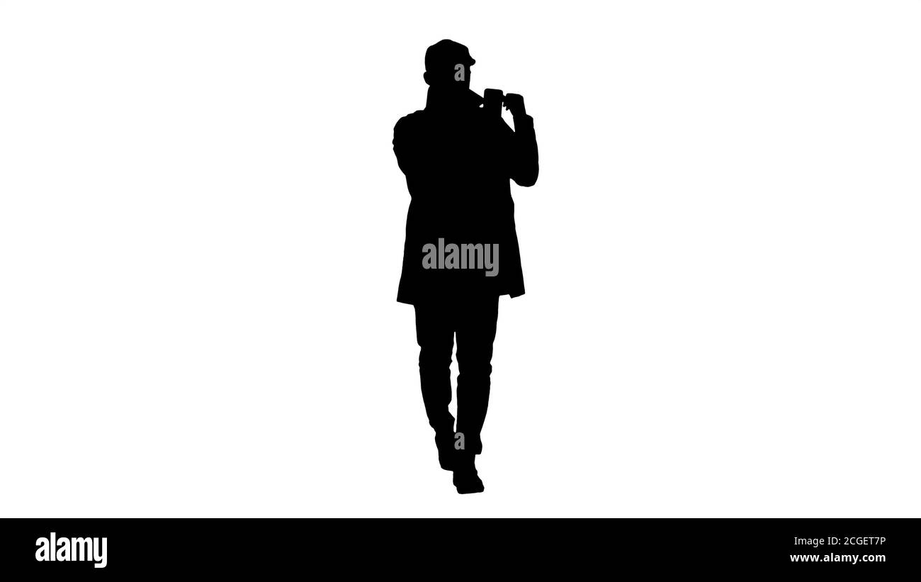 Silhouette Herbst Fashion Style mann Aufnahme Video Blog wandern. Stockfoto