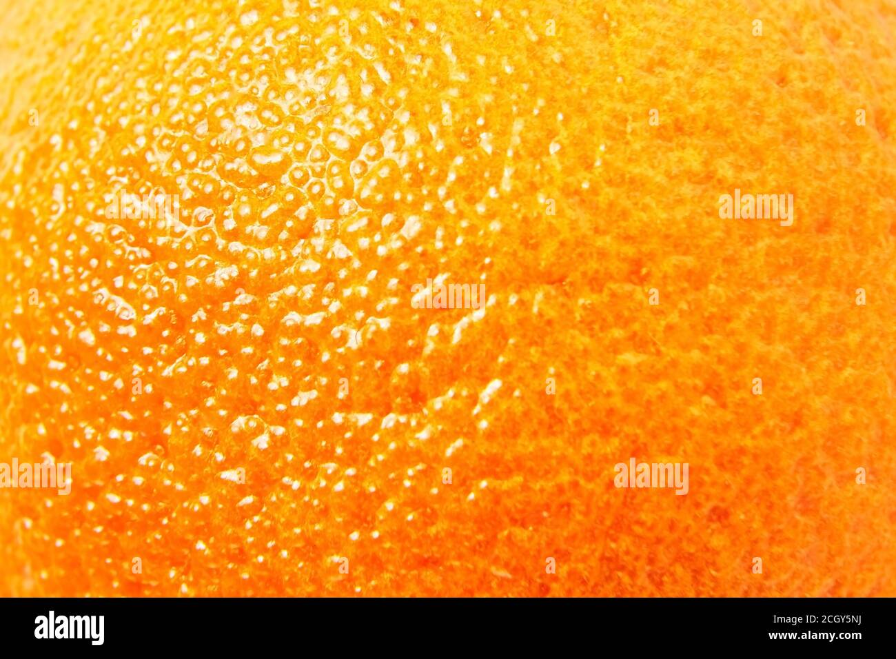 Mandarine, Mandarine, Mandarine orange Hautstruktur Nahaufnahme Details. Pickel Stockfoto