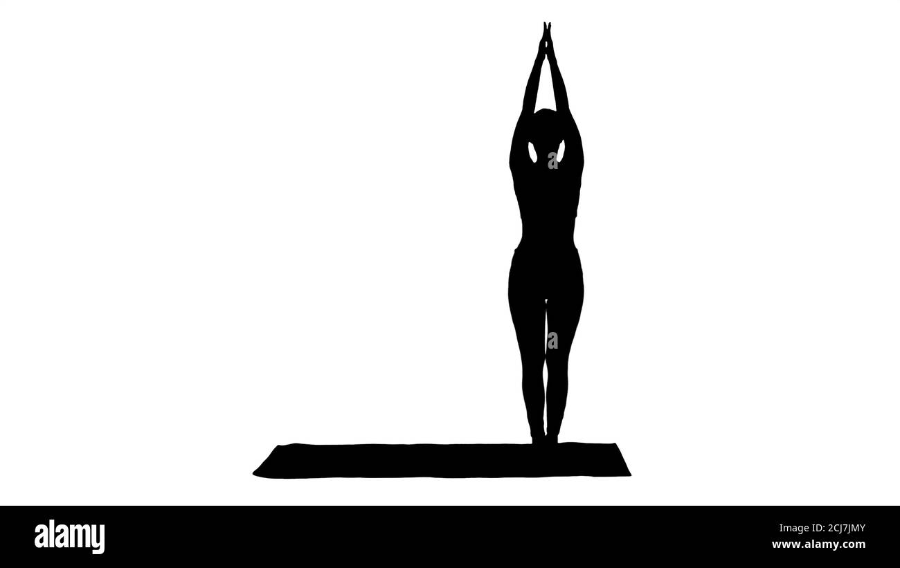 Silhouette sportliche junge Frau Yoga Praxis. Stockfoto