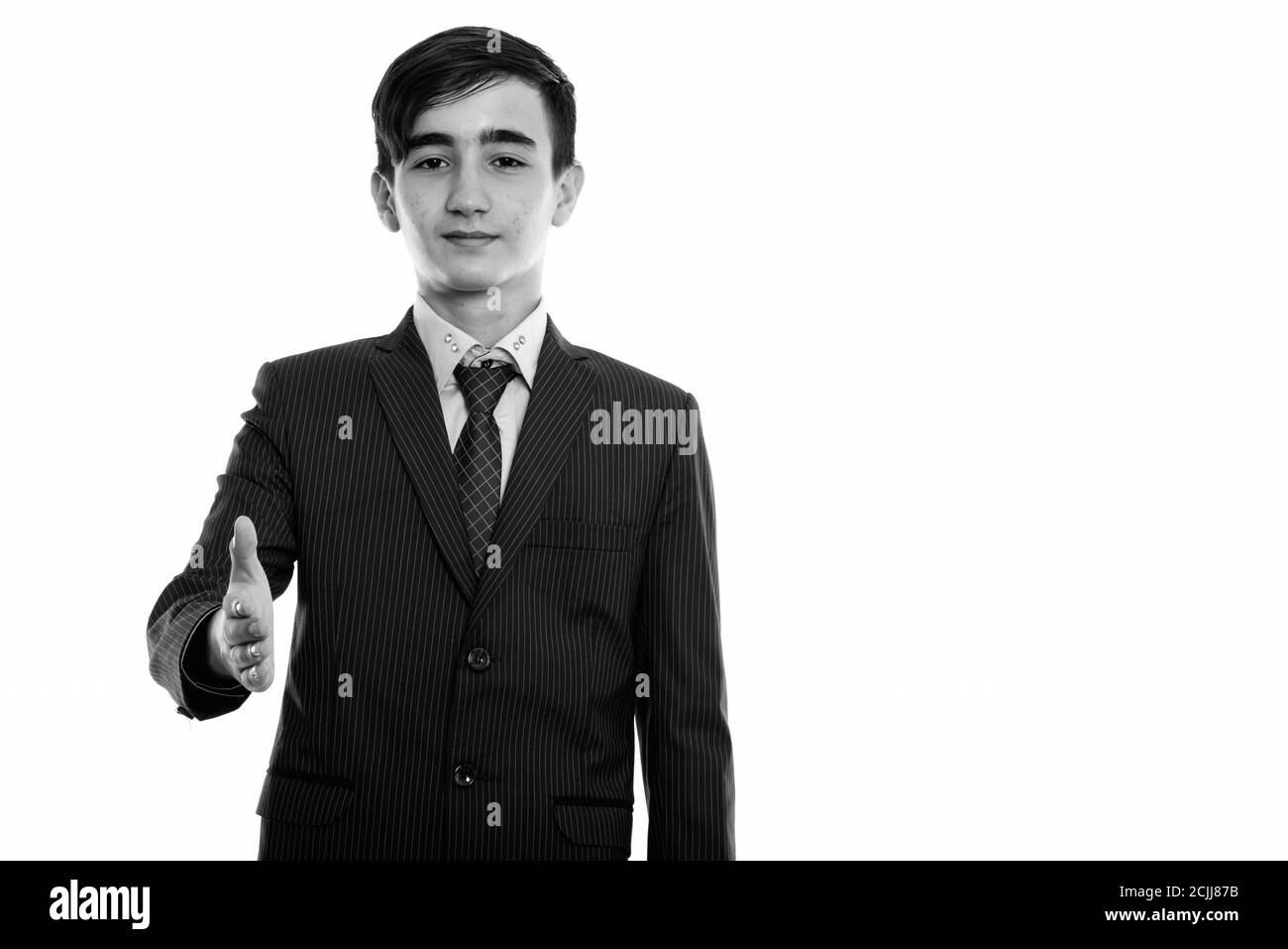 Studioaufnahme eines jungen, hübschen persischen Teenagers, der Handschlag gab Stockfoto