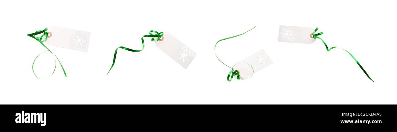 Eine Sammlung von Geschenk-Tags und Label-Vorlage mit grünen Band befestigt, um Geschenke, Weihnachten oder Geburtstagsgeschenke isoliert gegen einen weißen Rücken hinzuzufügen Stockfoto