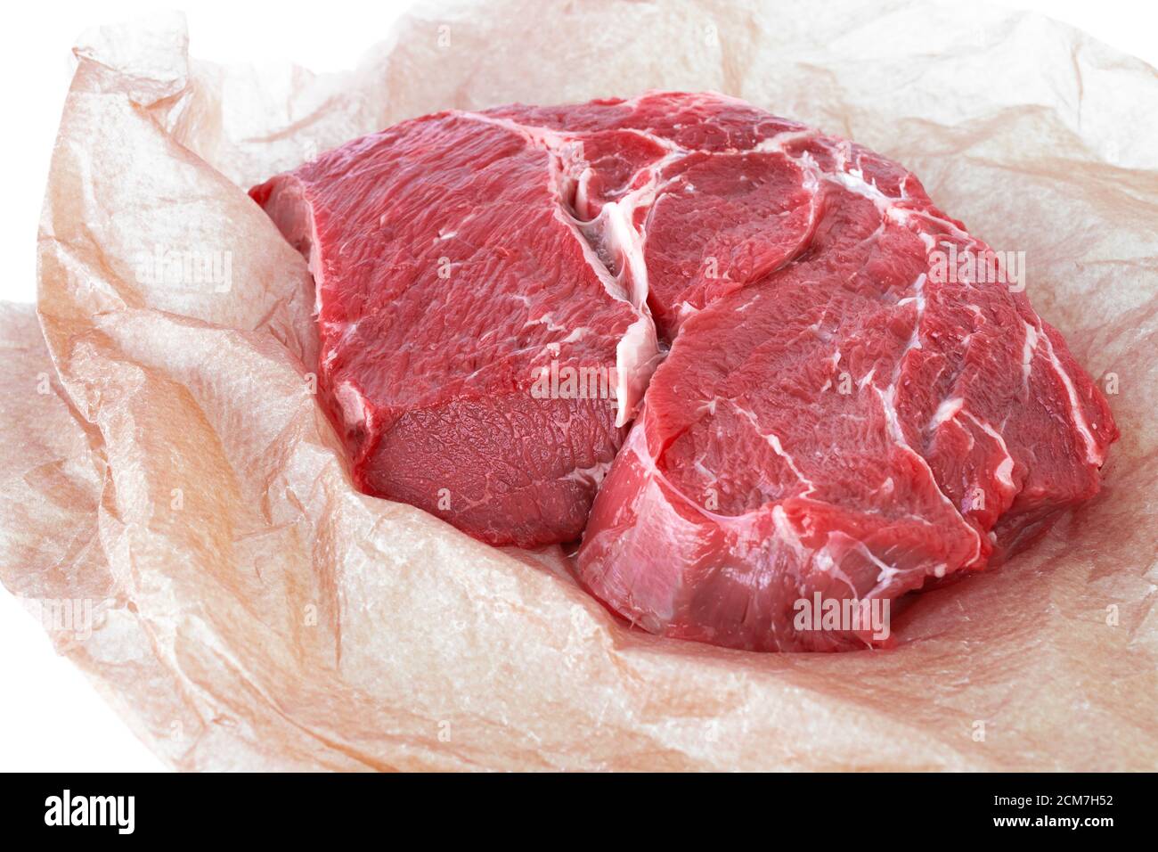 Frisches Stück Rohes Rindfleisch auf Geschenkpapier Stockfoto
