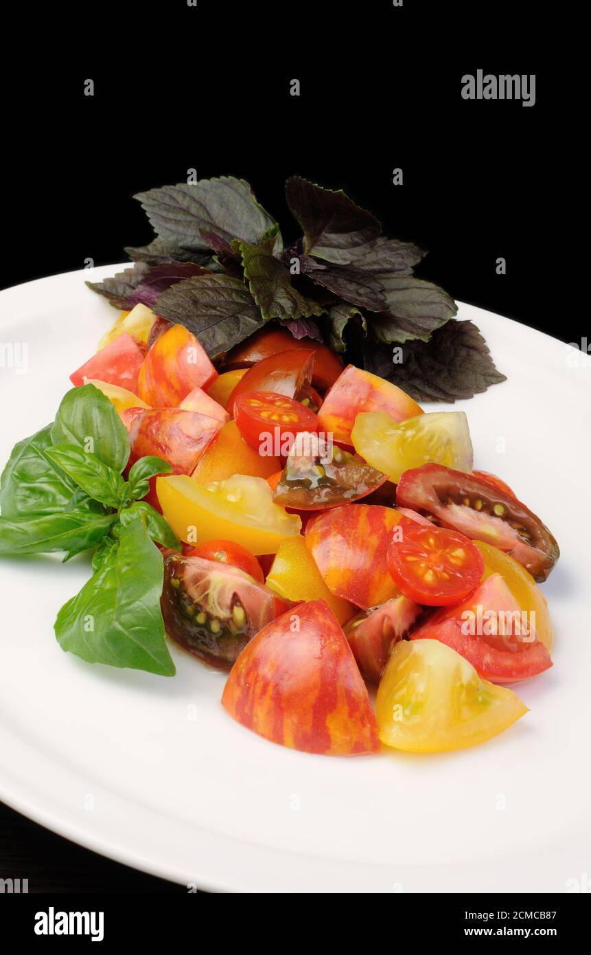 Scheiben von verschiedenen Sorten von Tomaten Stockfoto