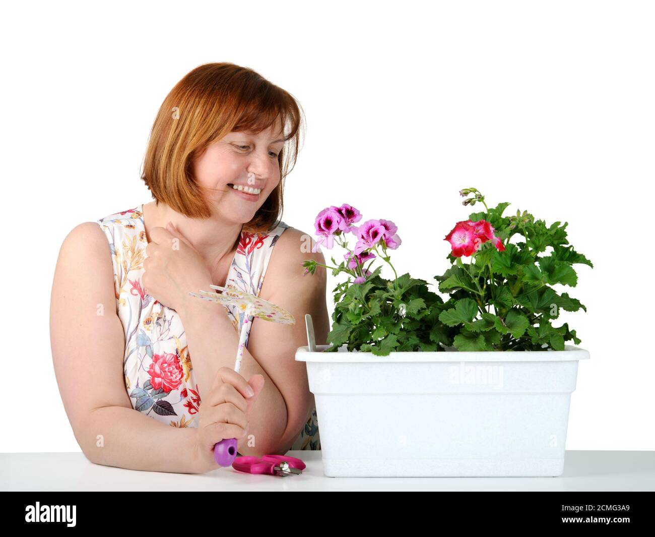 Porträt von Frauen mittleren Alters, Pflanzen bewundern. Stockfoto
