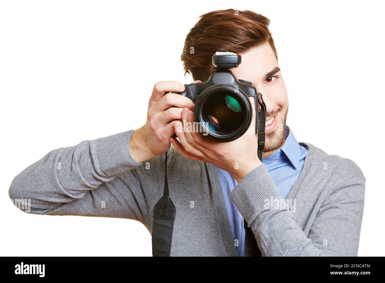 Lachende Hochzeitsfotograf fotografiert mit Kamera und Funkauslöser Stockfoto