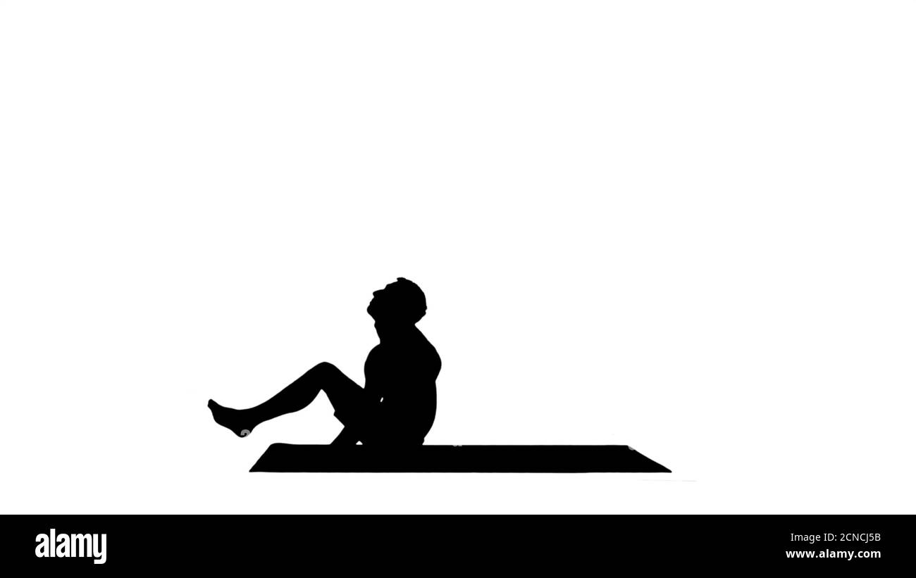 Silhouette Yoga DWI Pada Sirsasana Füße hinter dem Kopf Pose. Stockfoto