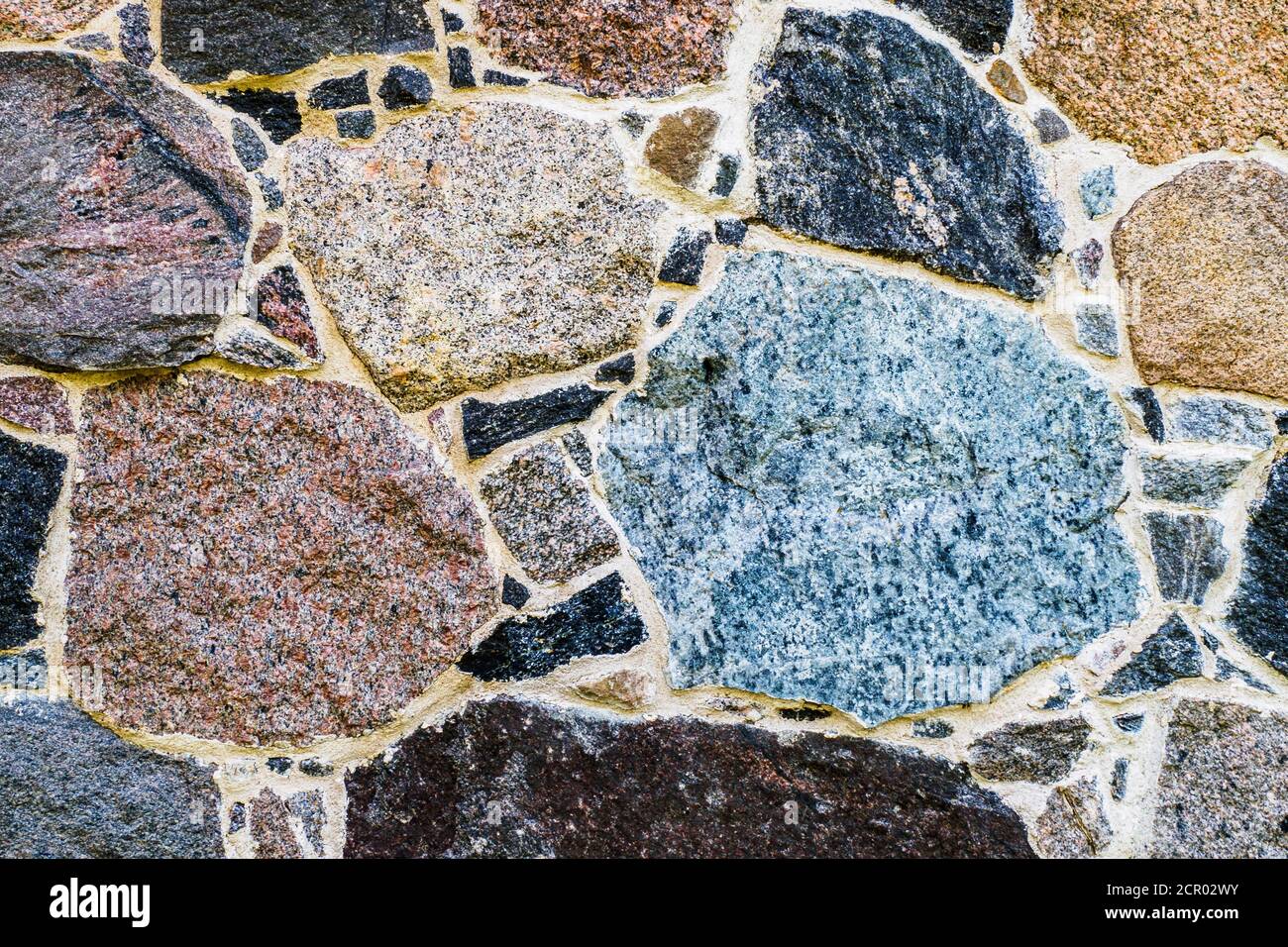 Die Textur einer Steinwand. Alte Burg Stein Wand Textur Hintergrund. Steinwand als Hintergrund, Banner, Hintergrund, Tapete, Poster oder dekorativ Stockfoto