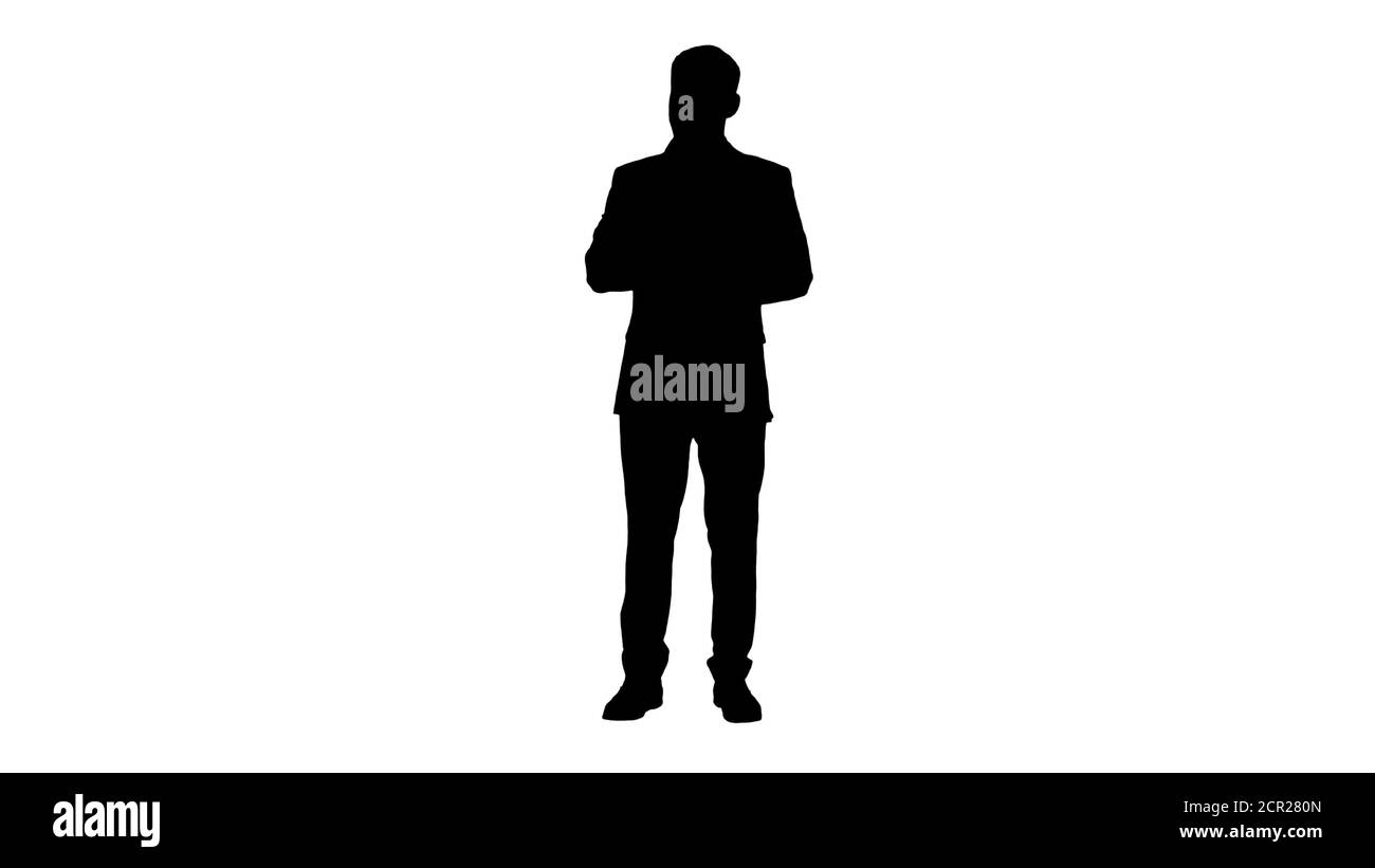 Konzentrierter junger Mann in formalwear mit Notizblock und Schreibblock Stockfoto