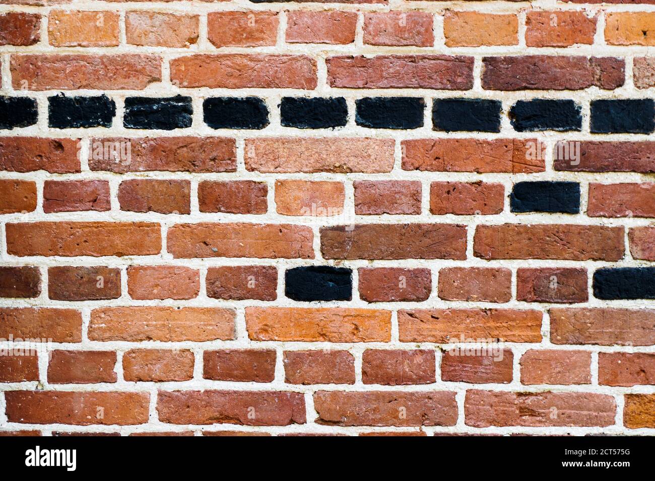 Abstrakte Alte Ziegelwand. Raue strukturierte Hintergrund der alten braunen Ziegelwand Stockfoto