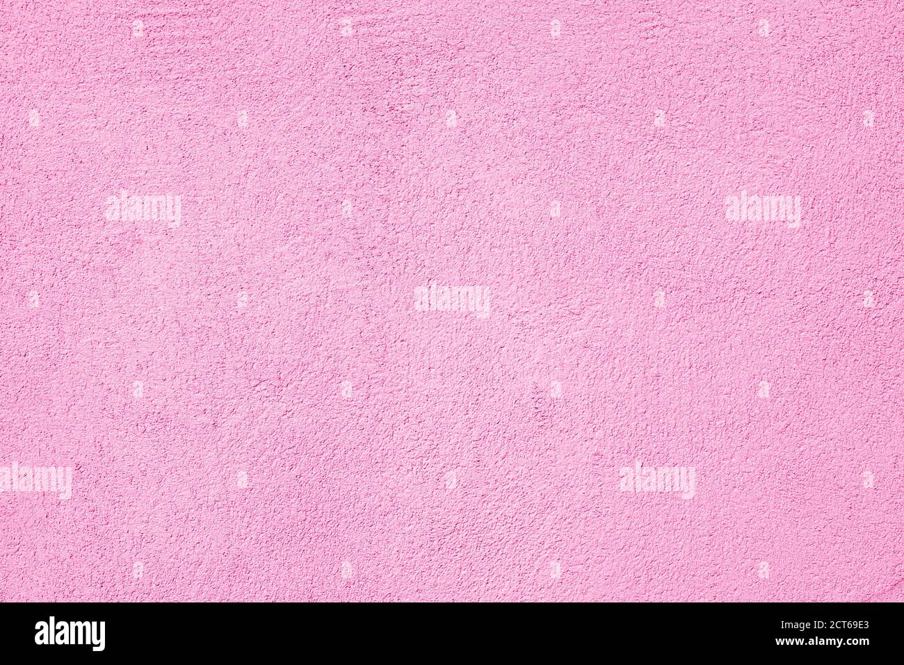 Abstrakte rohe rosa Textur. Abstrakter architektonischer Hintergrund. Verputzte Gebäudewand. Stockfoto