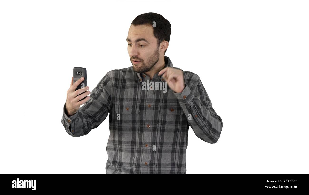 Junger Blogger, der Video auf seinem Handy aufzeichnet, während er weiter geht Whit Stockfoto